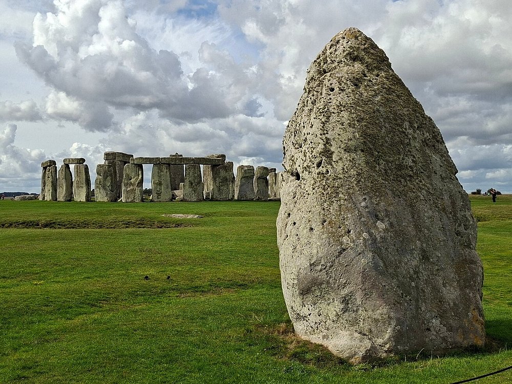 The Heel Stone in the foreground with the Stonehenge circle beyond